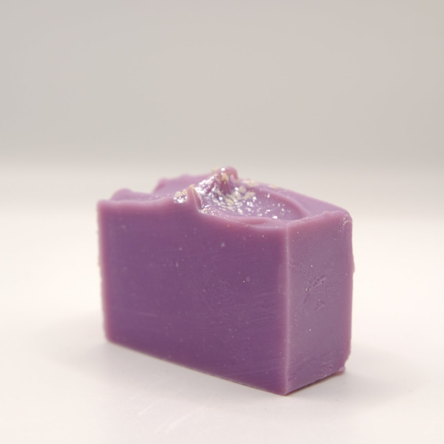 Purple soap bar on a white background