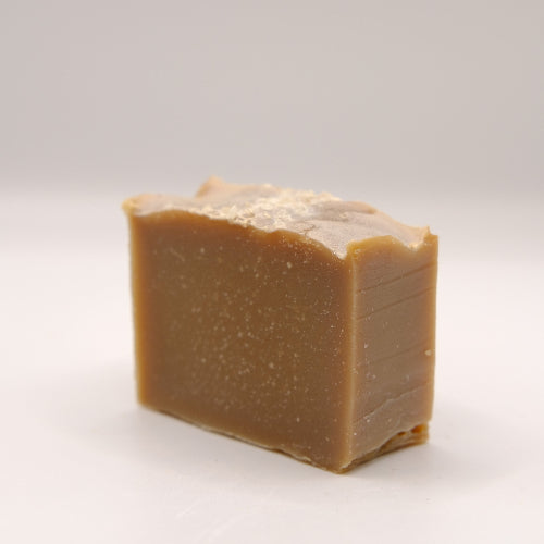 Bar of brown soap on a white background