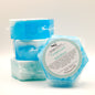 Hexagonal blue soap bar with a label on a white background