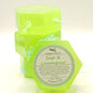 Four green soaps with labels on a light background