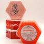 Hexagonal strawberry soap with a label on a white background