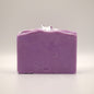Purple soap bar with a textured top and silver accents on a light gray background