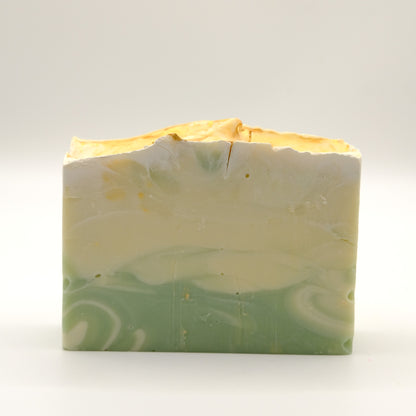 Green and beige soap bar on a white background