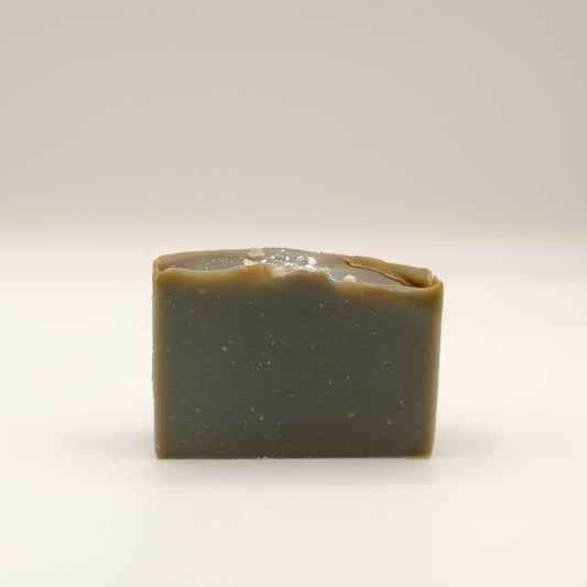 Grey rectangular bar of soap on a light background