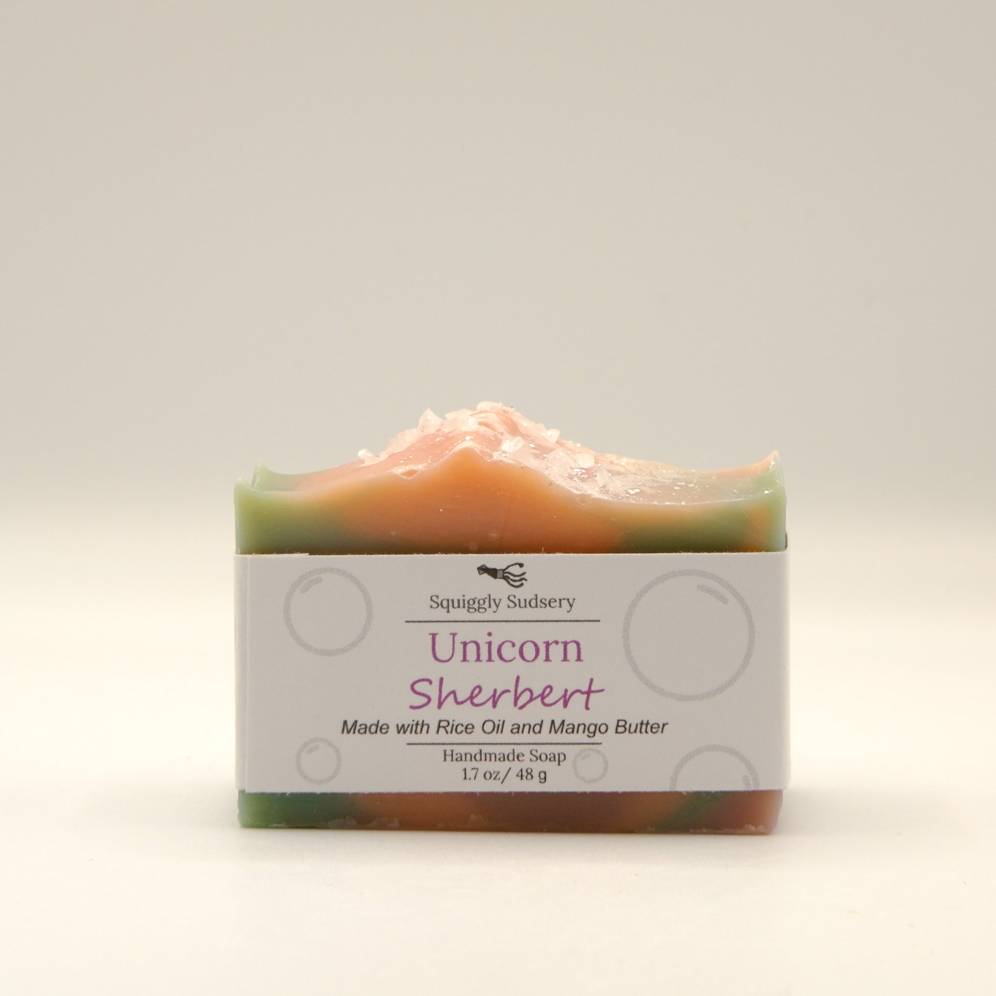 Bar of soap labeled 'Unicorn Sherbert' on a light background