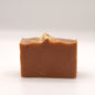 Brown bar of soap on a white background