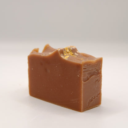 Block of brown soap on a white background