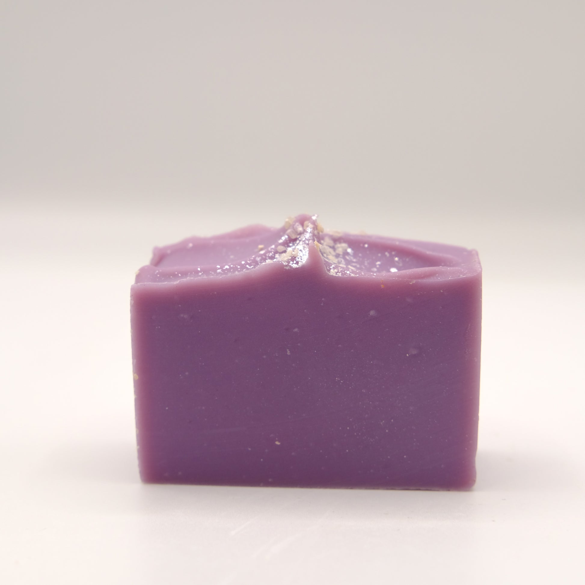 Purple soap bar on a white background