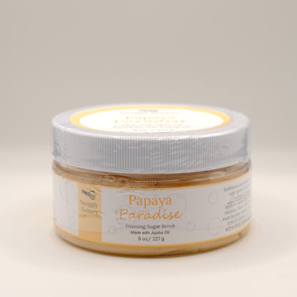 Jar of Papaya Paradise foaming sugar scrub on a beige background