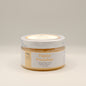 Jar of Papaya Paradise Foaming Sugar Scrub on a light gray background