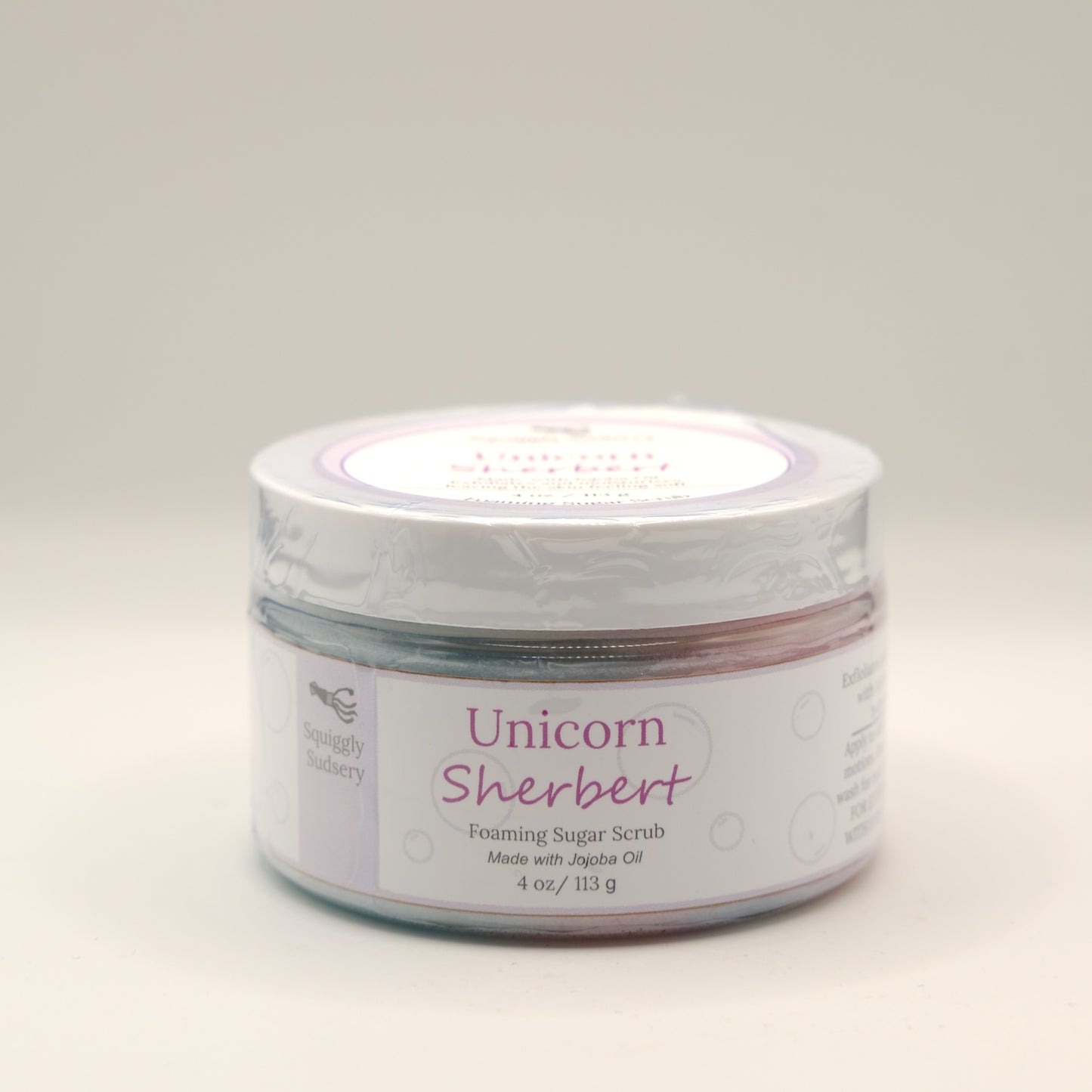 Jar of Unicorn Sherbert foaming sugar scrub on a white background