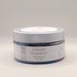 Jar of Unicorn Sherbert foaming sugar scrub on a light gray background