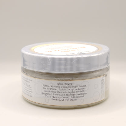 One jar of Vanilla Buttercream body scrub on a light background