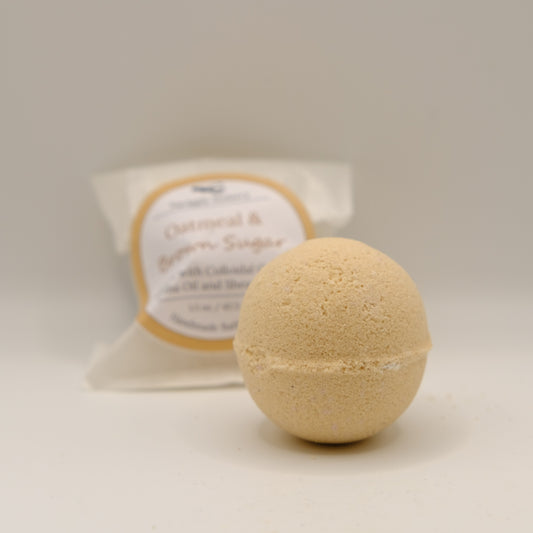 Bath bomb and packaging on a light gray background