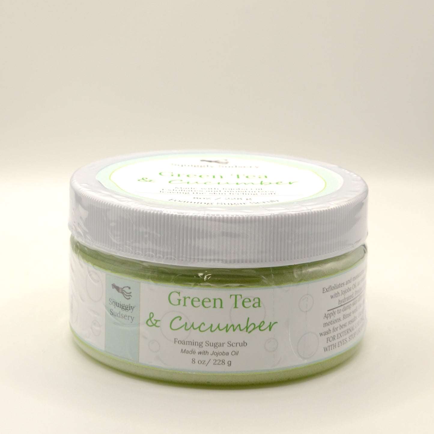 Eight-ounce jar of Green Tea & Cucumber foaming sugar scrub on a white background