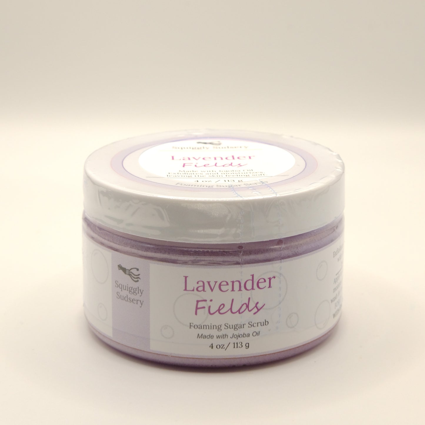 4-ounce jar of Lavender Fields foaming sugar scrub on a white background