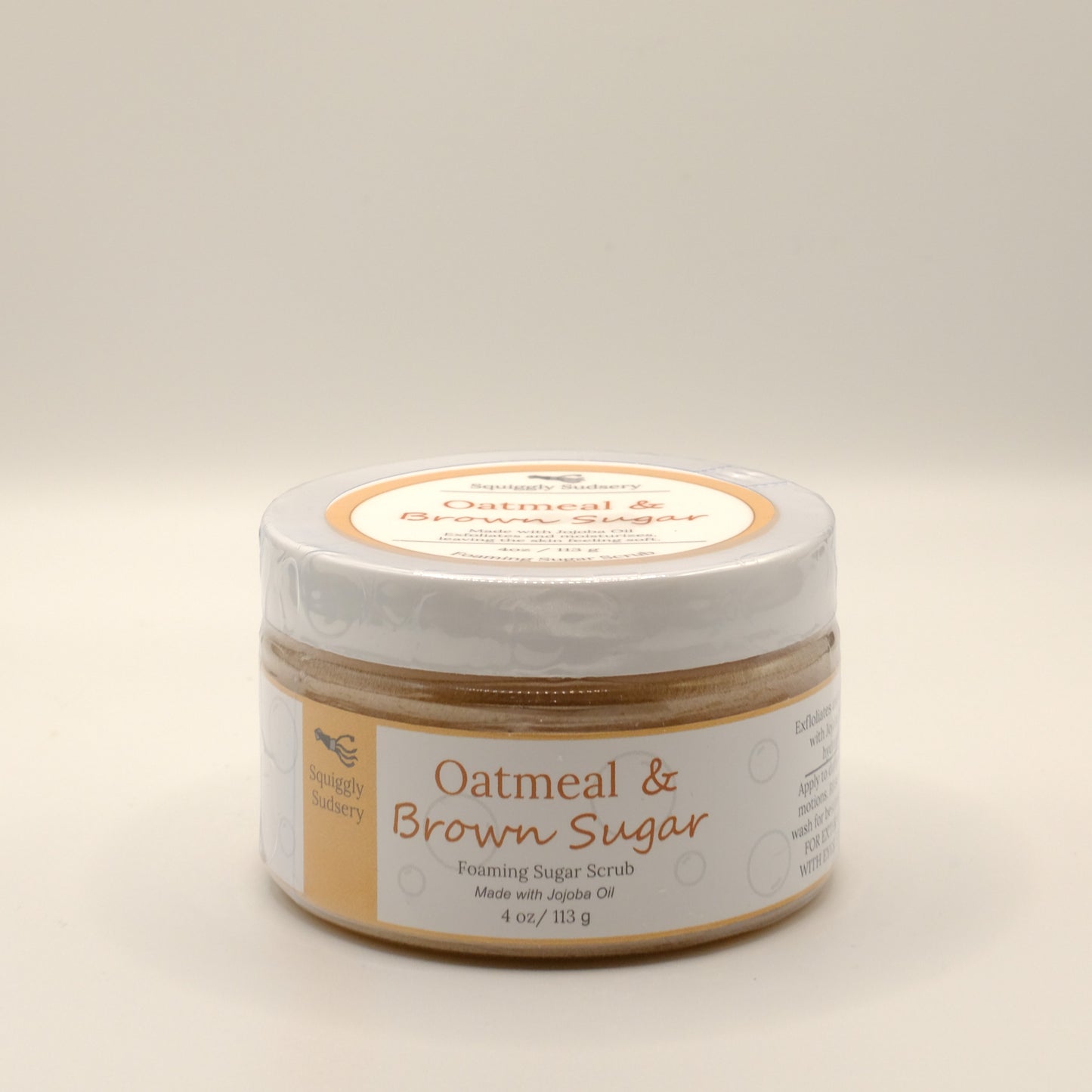 Four-ounce jar of Oatmeal & Brown Sugar scrub on a light background
