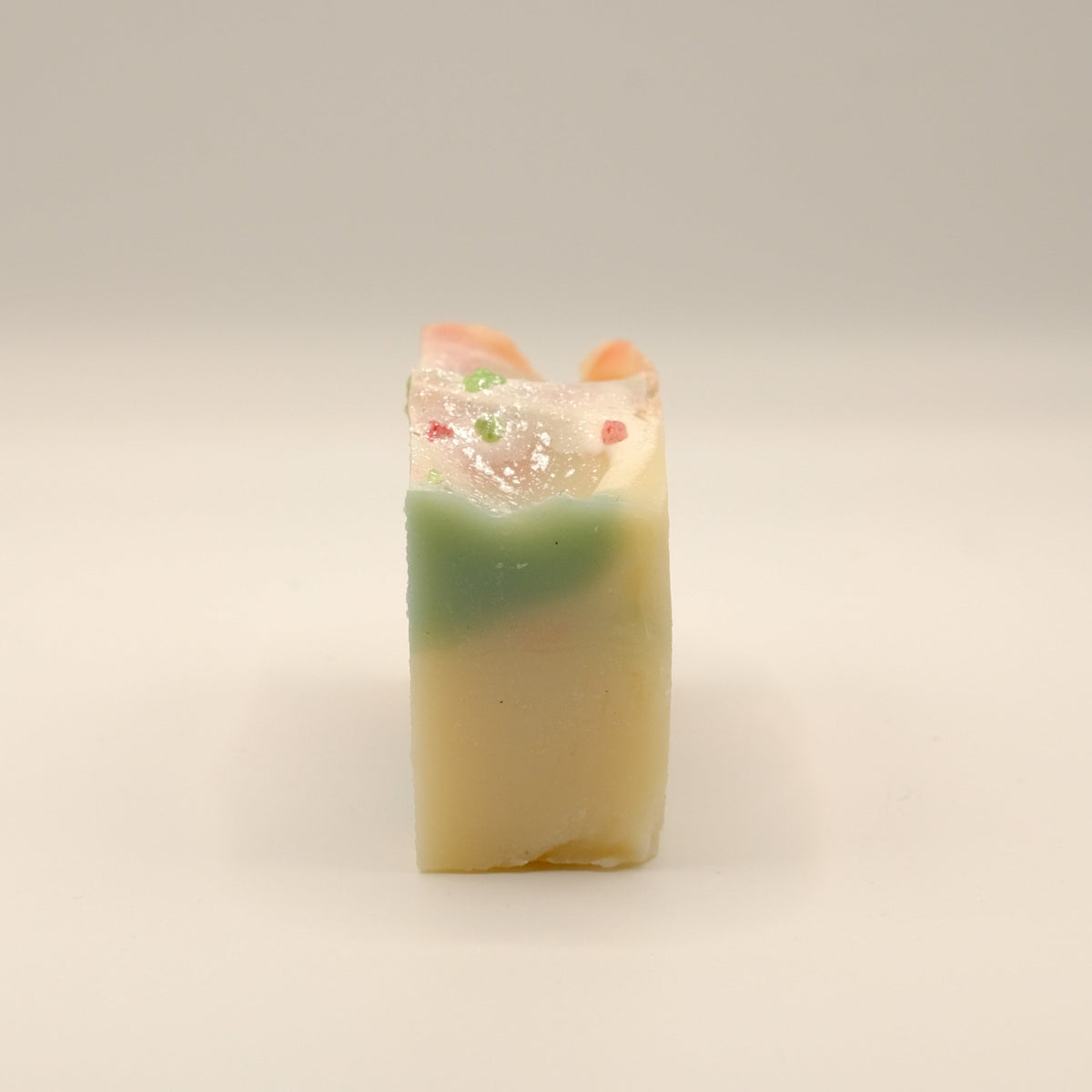 Colorful soap bar with a textured surface on a light background