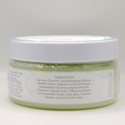 Jar of green sugar scrub with white lid on a light gray background