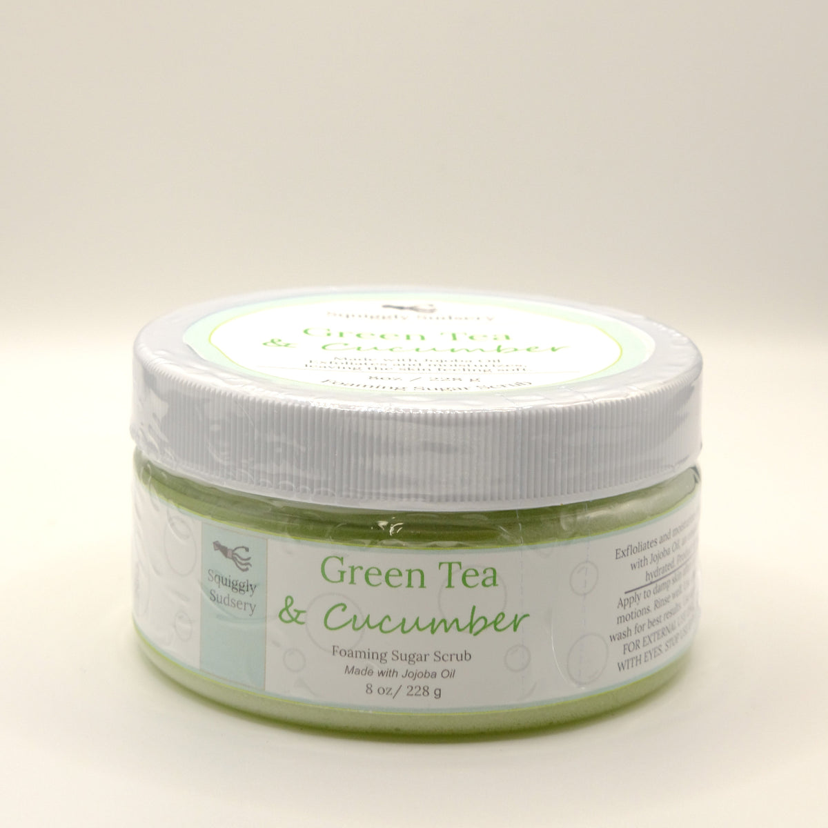Eight-ounce jar of Green Tea & Cucumber foaming sugar scrub on a white background
