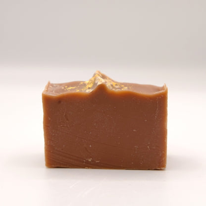 Brown bar of soap on a white background