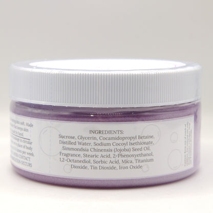 Jar with a white lid and purple sugar scrub on a light gray background