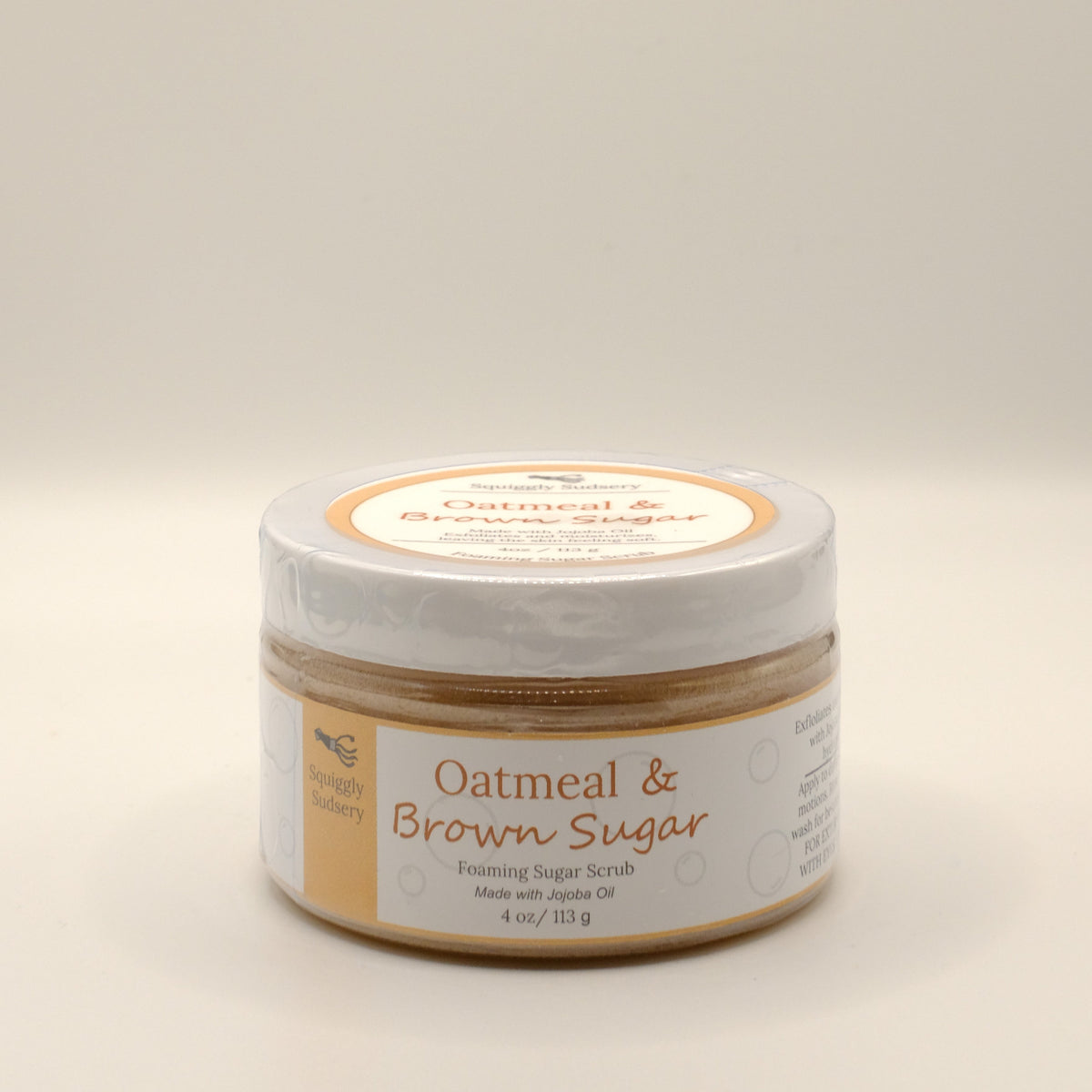 Four-ounce jar of Oatmeal & Brown Sugar scrub on a light background