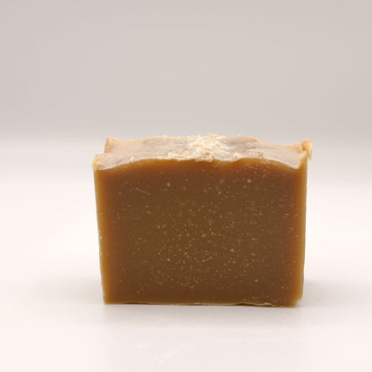 A brown bar of soap on a white background