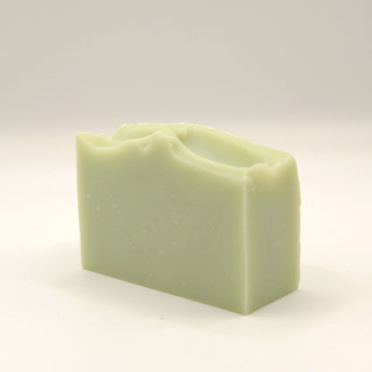 Green soap bar on a light background