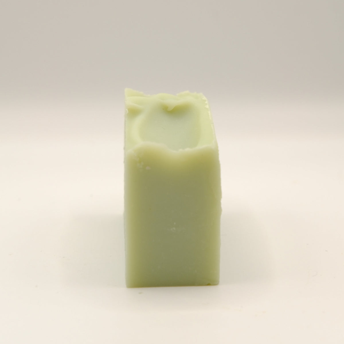 Green rectangular soap bar on a light background
