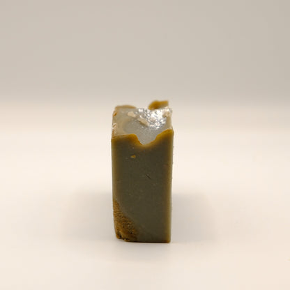 Rectangular bar of soap with a textured surface on a light background