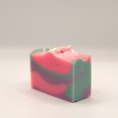Multicolored soap bar on a light gray background
