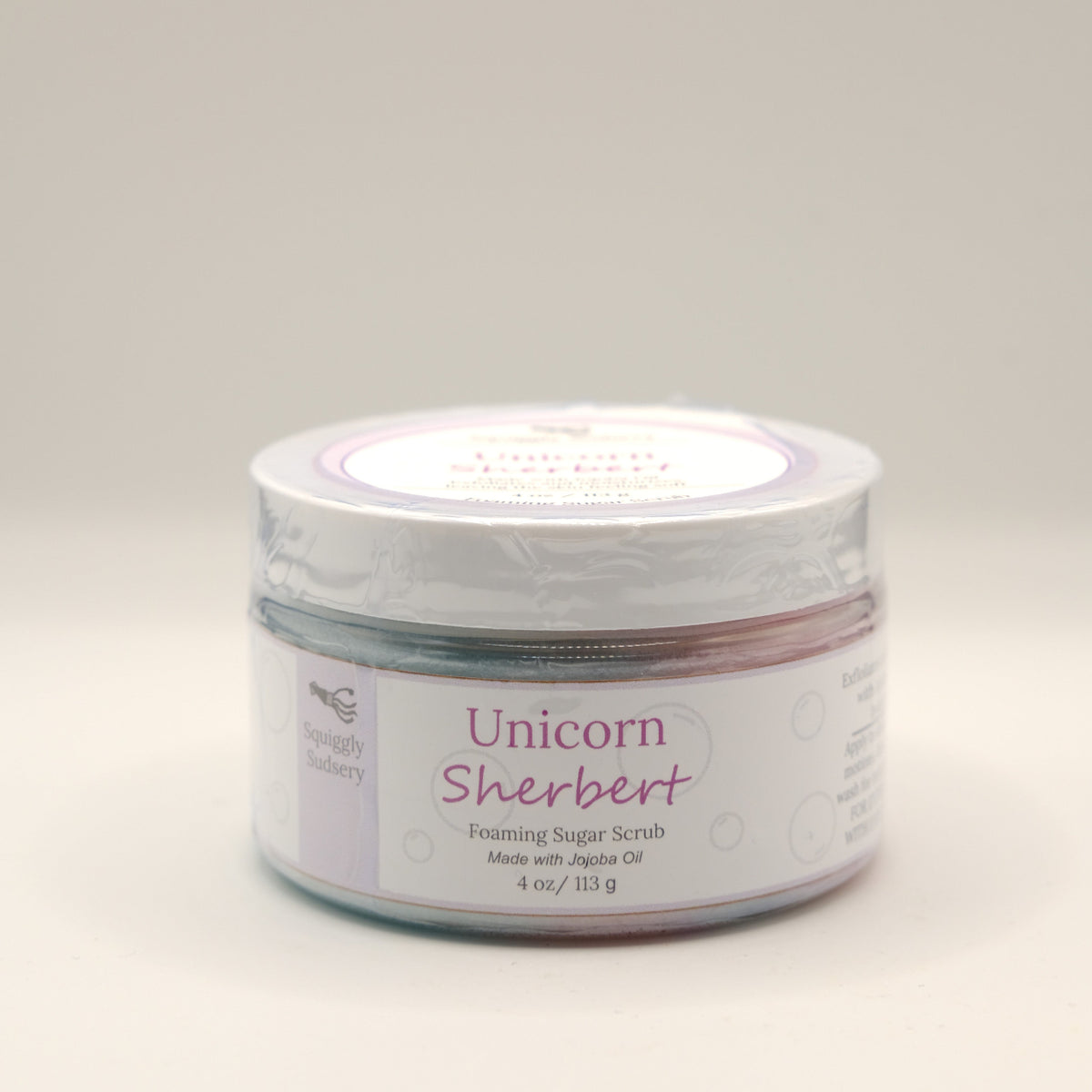 Jar of Unicorn Sherbert foaming sugar scrub on a white background