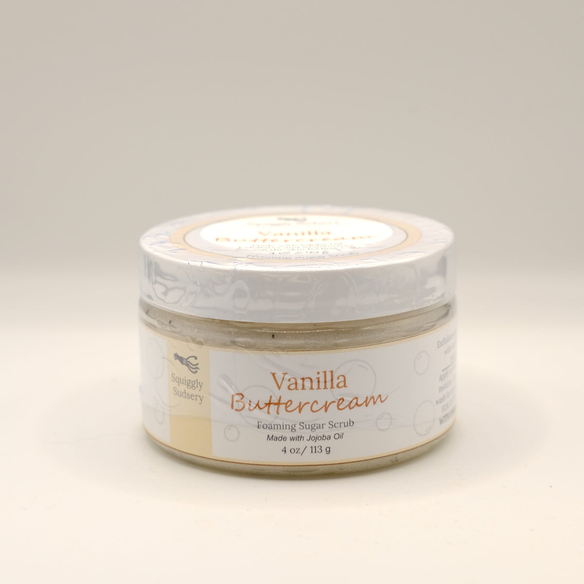 Jar of Vanilla Buttercream foaming sugar scrub on a light gray background