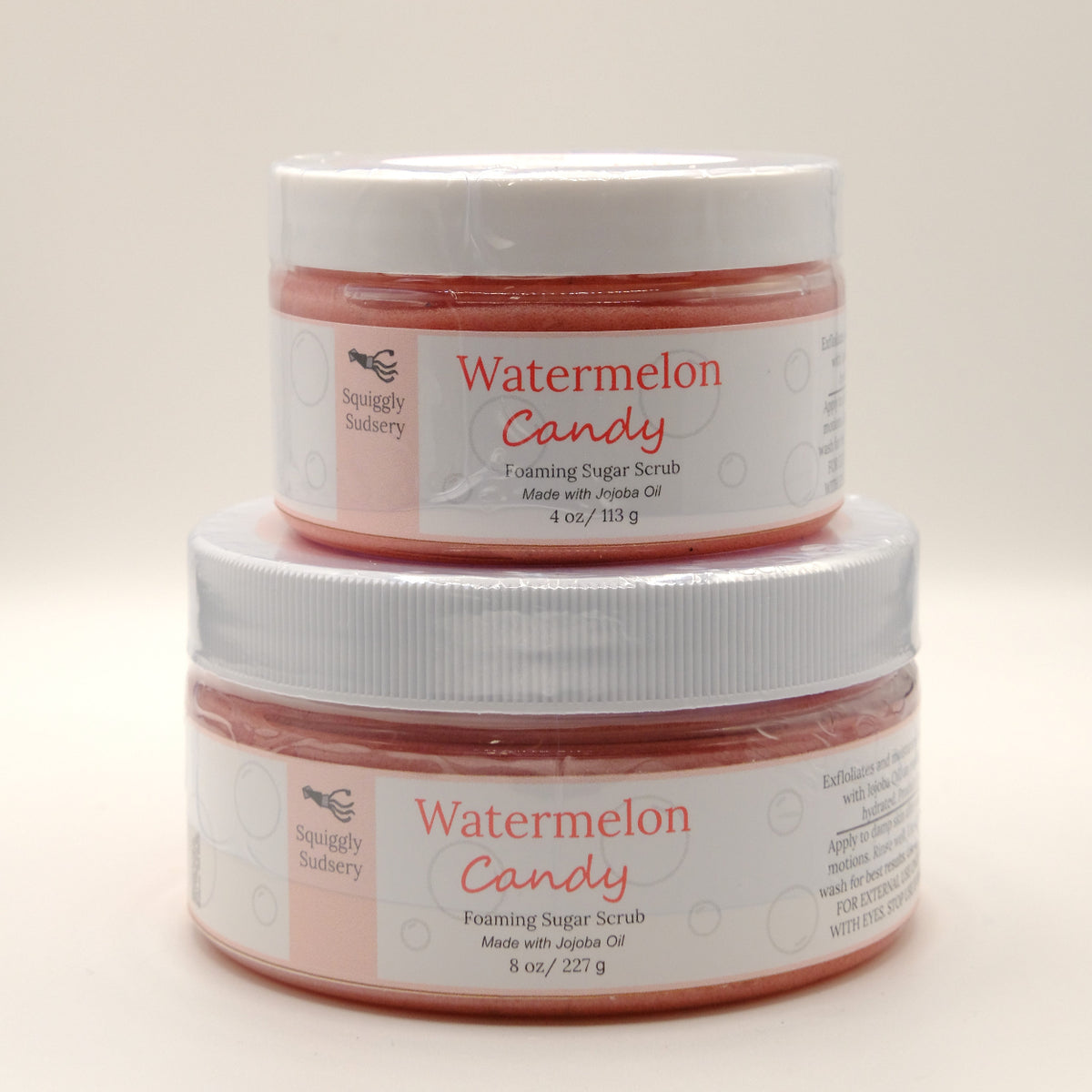 Two jars of 'Watermelon Candy' foaming sugar scrub on a white background.
